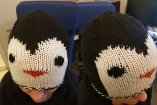 Friendly front and side of penguin beanie